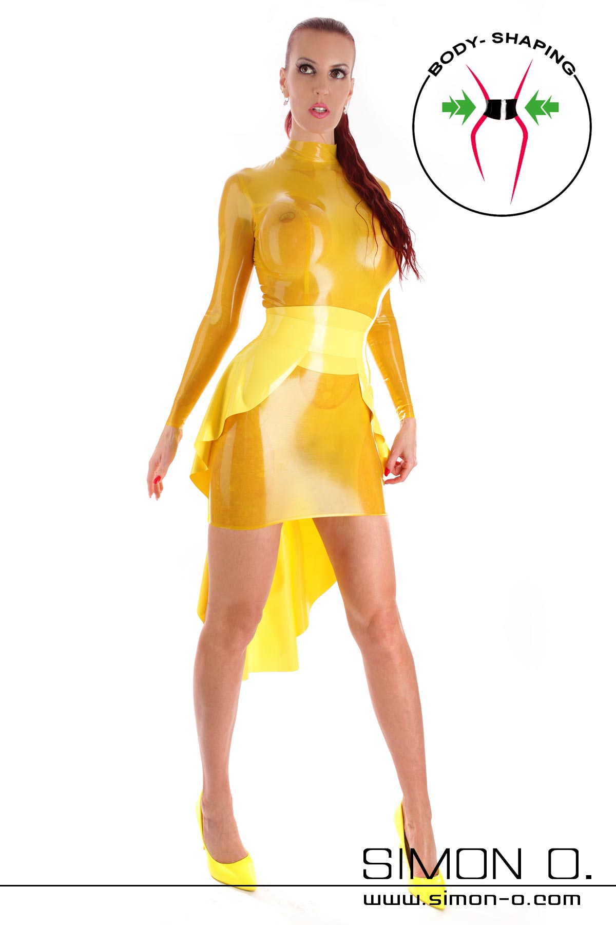 Latex dress in yellow with train A woman in a shiny yellow latex mini dress with waist belt and matching heels poses in front of a white background seen from the front.