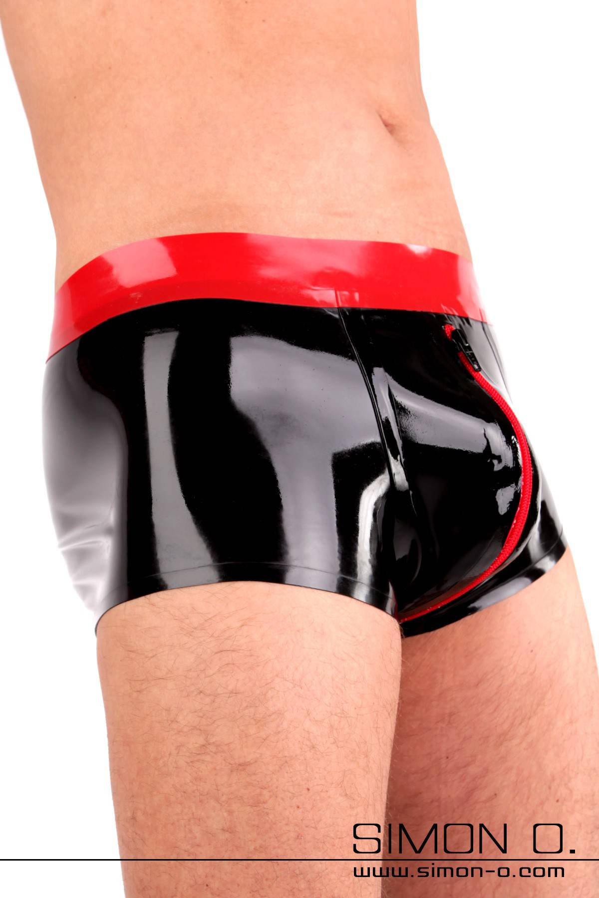 Latex Shorts for Men with Codpiece A man wears a black shiny latex shorts with condom and codpiece