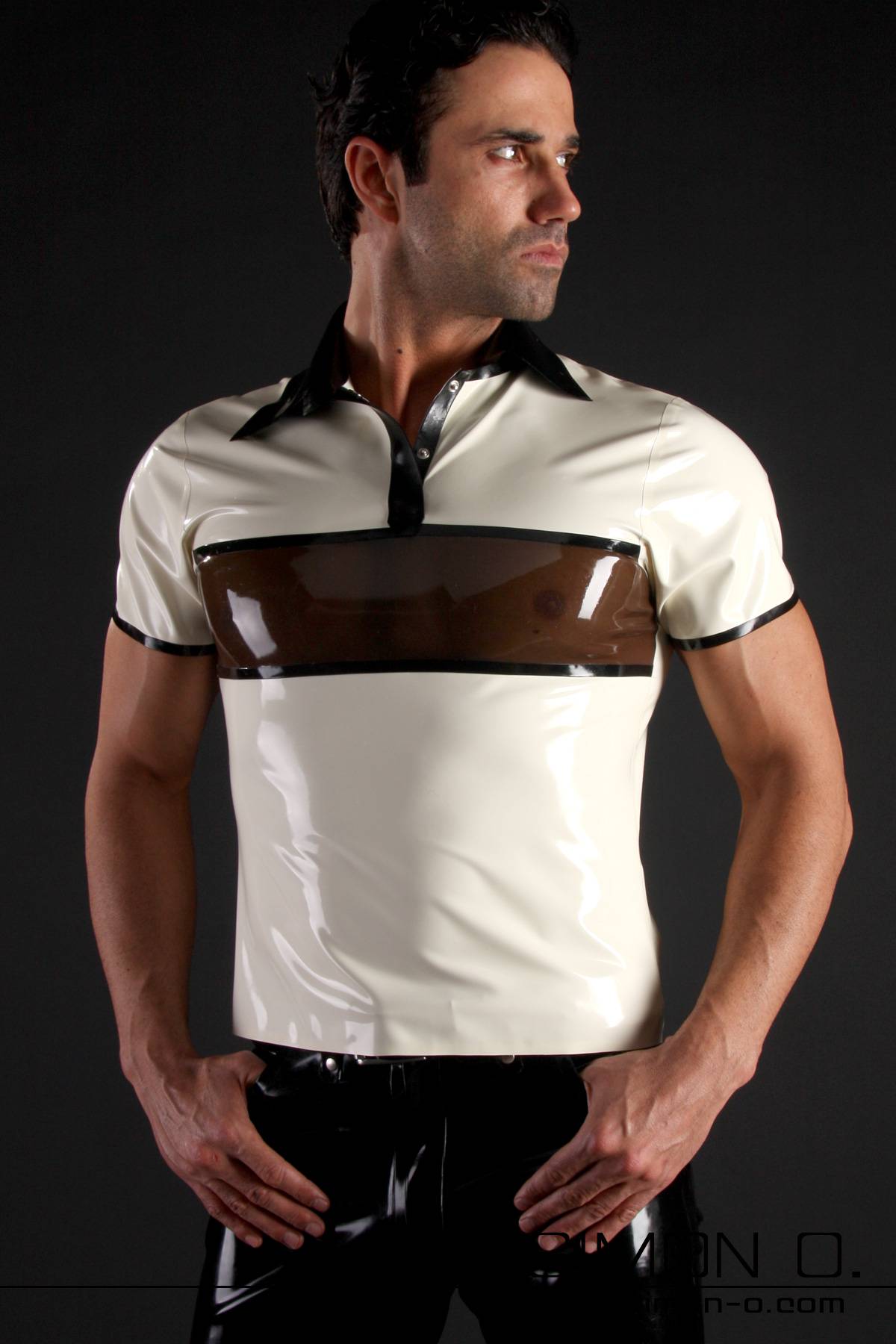 Latex Polo Shirt 3 Coloured - POLO2 A man stands with his hands on his hips wearing a shiny white latex polo shirt with short sleeves, a black collar and a translucent brown stripe across his chest.