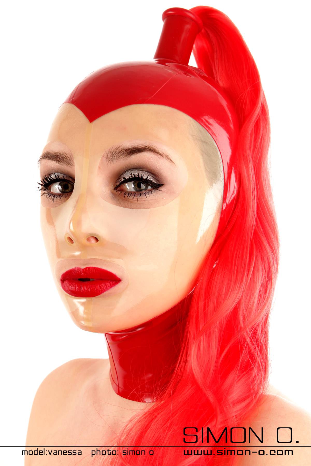 Domina Latex Maske in Rot mit transparentem Gesicht Domina Latex Maske in Rot mit transparentem Gesicht und Haarteil in Rot