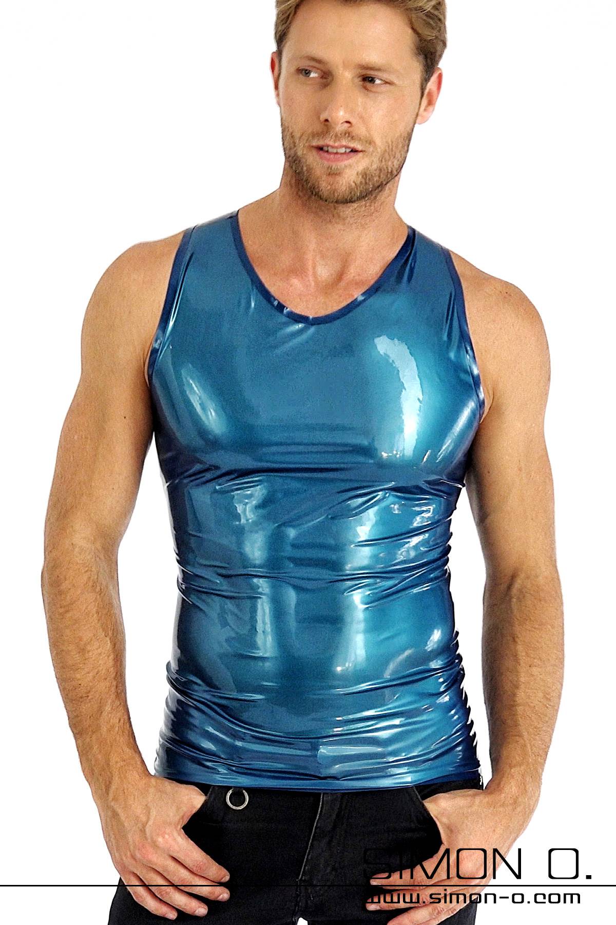 Latex shirt without sleeves in blue A man wears a skintight shiny latex shirt without sleeves in blue with dark blue edging.