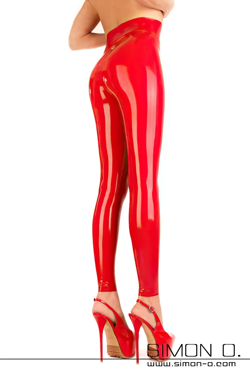 Legs and bum in tight red gloss latex leggings with high waistband that goes up to the waist