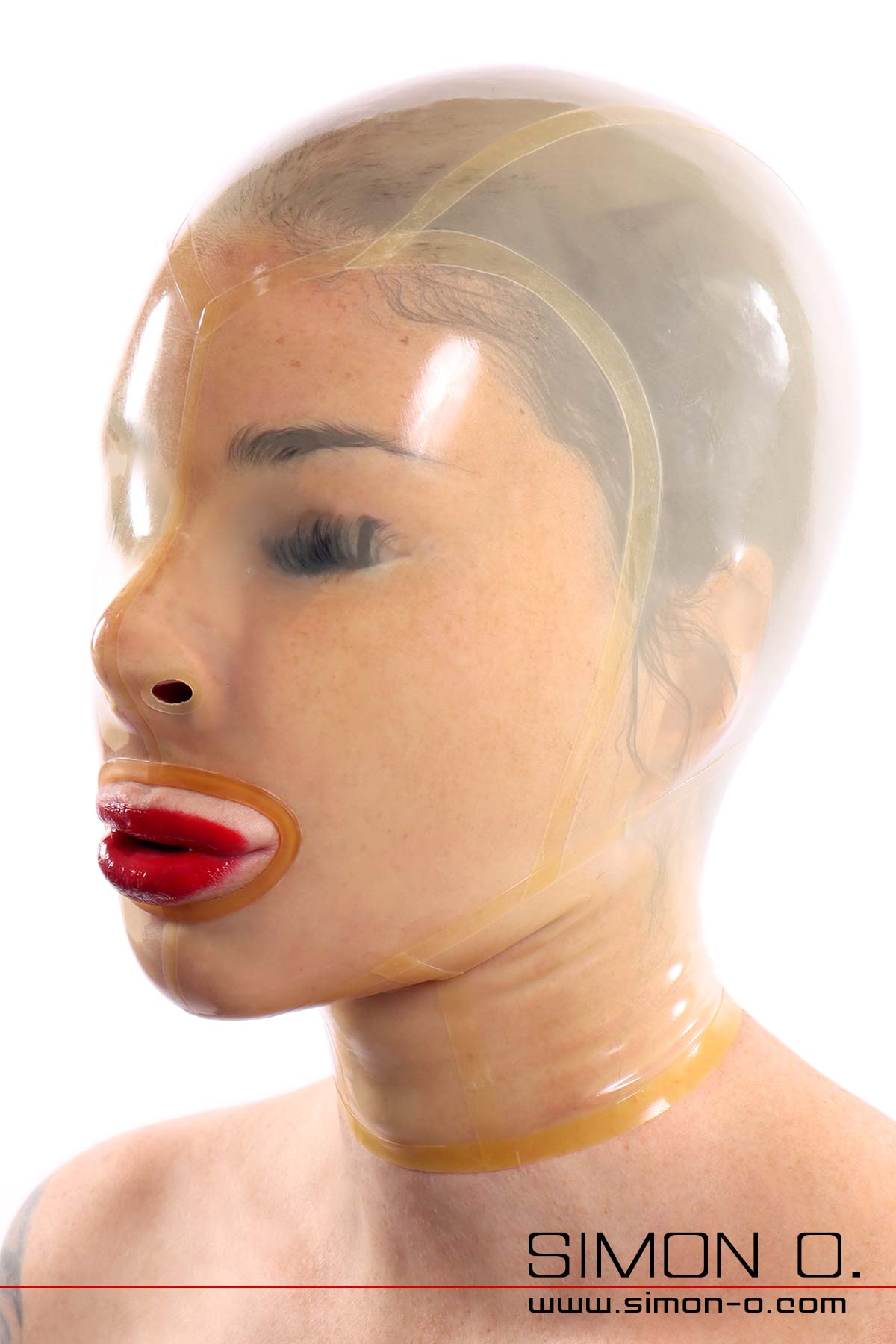 Transparent latex mask A transparent latex mask without eye openings fits snugly around the face of a woman with red lips.