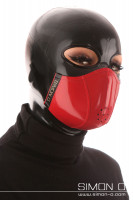 Preview: A woman wears a red latex face mask over a shiny black latex mask.