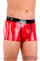 Preview: A man wears a skintight shiny men's latex underpants in red with black waistband