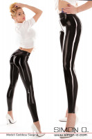Preview: A blonde woman wears shiny black latex leggings with a white blouse.