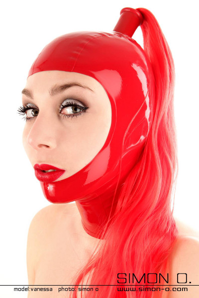 Red shiny latex hood with a long red ponytail worn by a woman with red lips
