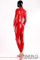 Preview: A man wears a tight skintight red latex suit with zipper in the crotch and a black latex hood seen from behind