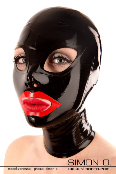 A woman with red lips wears a shiny tight latex hood in black with cat eyes and red mouth