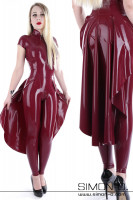 Preview: A blonde woman wearing a color fitting latex train over a catsuit