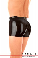 Preview: A man wears black shiny latex underpants seen from behind