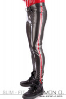 Preview: A man wears shiny dark gray latex trousers with red stripes down the sides.