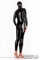 Preview: A man wears a black mask with a close fitting shiny black latex suit with entry zipper in the back of the crotch seen from behind